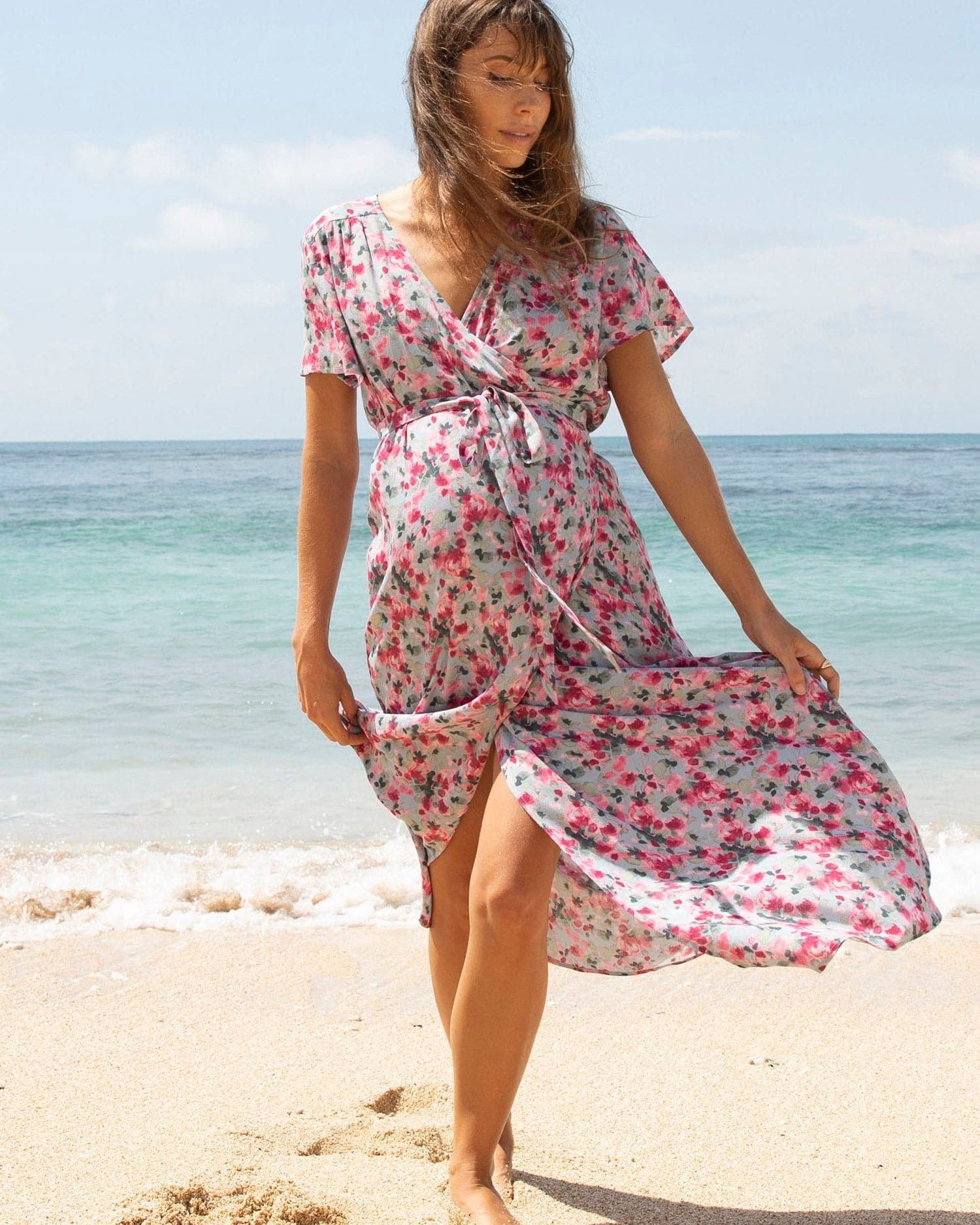 Main View - A pregnant Woman in Floral Pink Nursing Friendly Maternity Wrap Dress  on the Beach