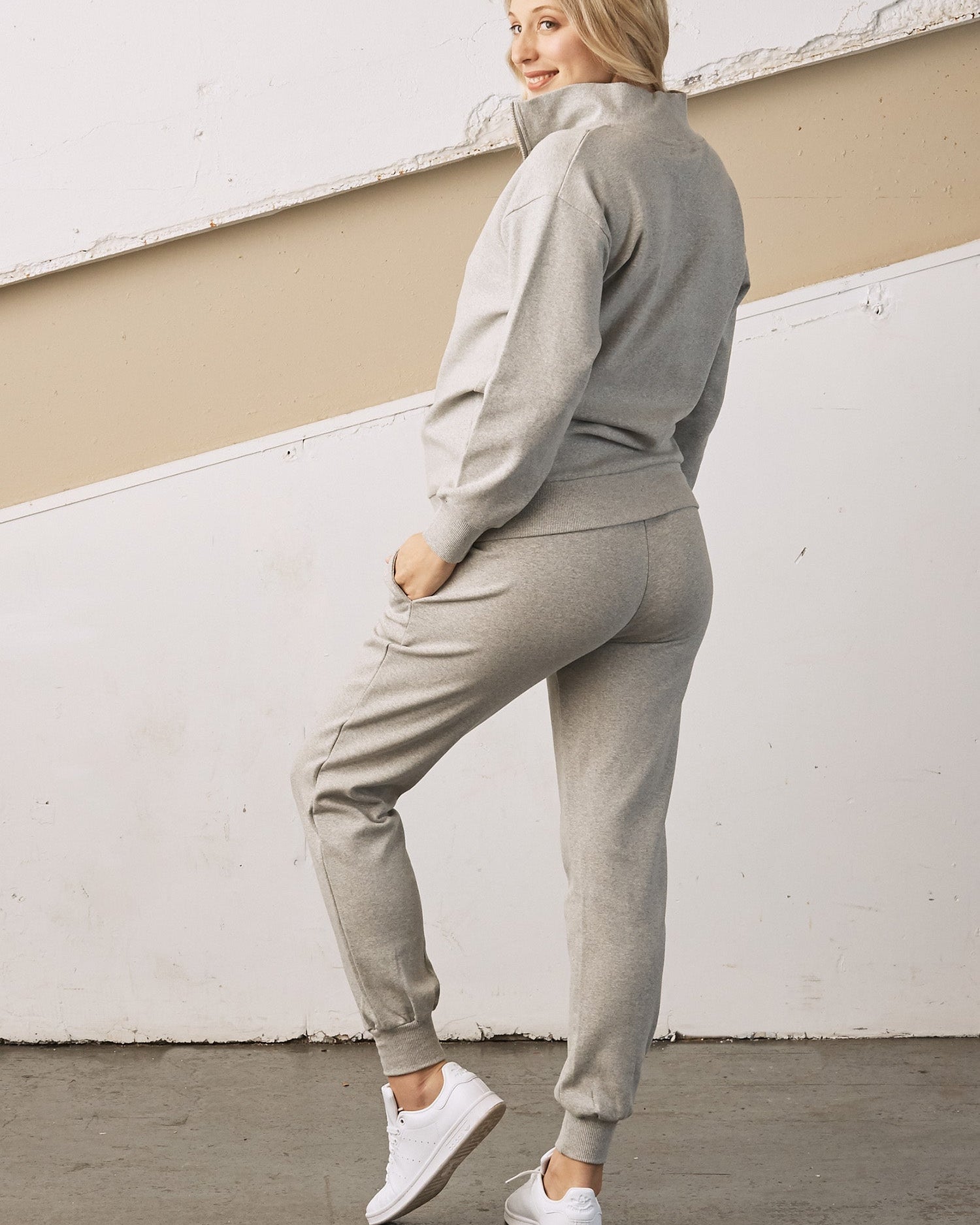 Side view - A pregnant woman in 2-Piece Calla zip front grey Maternity Tracksuit Set (6726621003870)