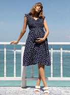 A woman in linen maternity spot dress, main (6681442353246) (6690185085031)