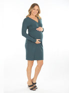 A woman in Madison cross over teal maternity dress, side (6593995014247)