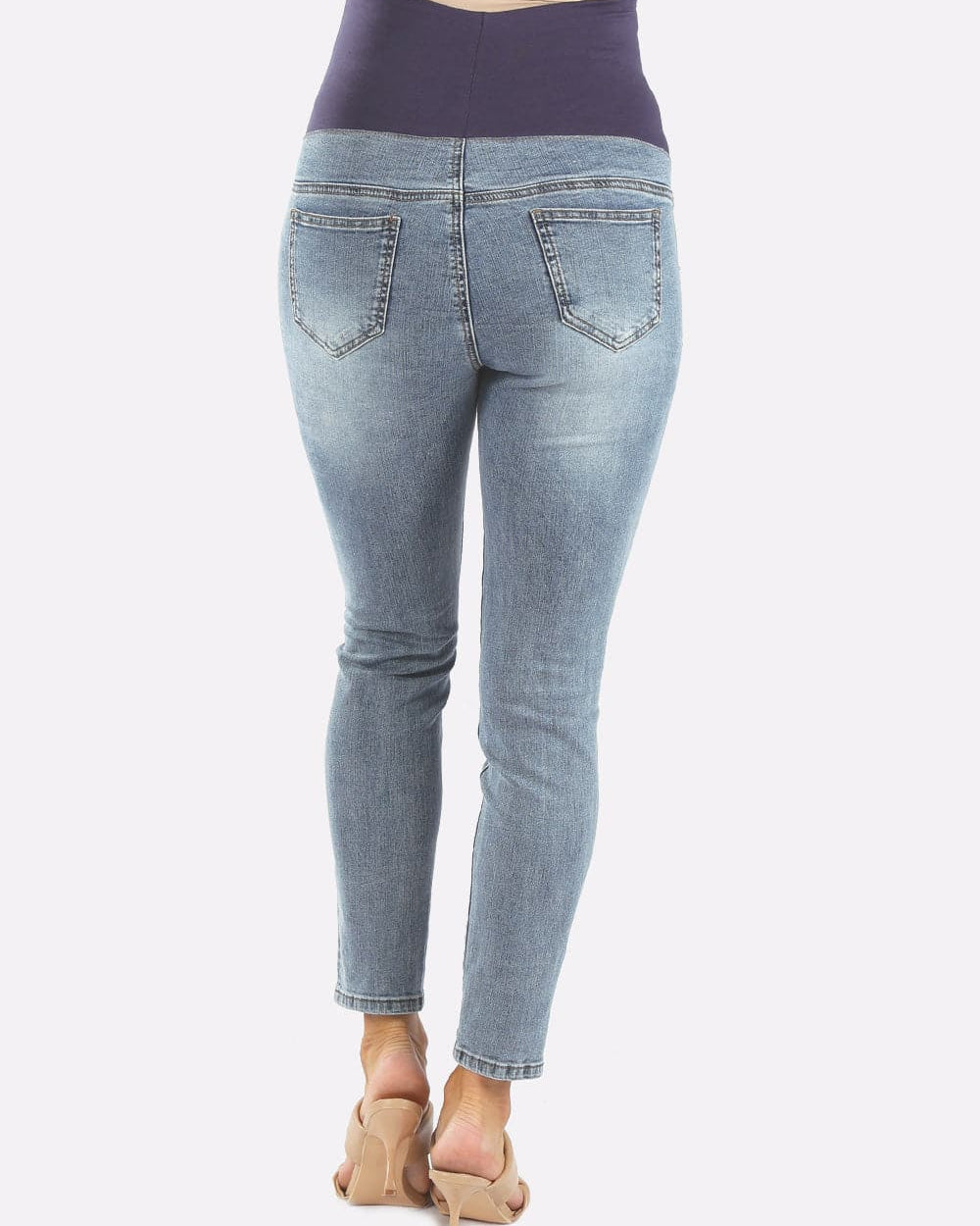 A woman in over the bump high waist Denim washed blue maternity jeans, back (6579096649831)